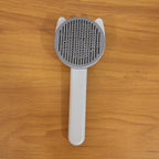 Reusable pet shedding needle comb